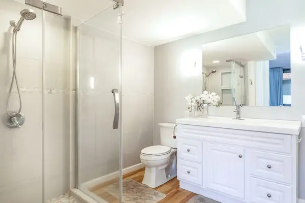 Clean Modern Bathroom with Vanity, Toilet, and Shower/Tub Combo