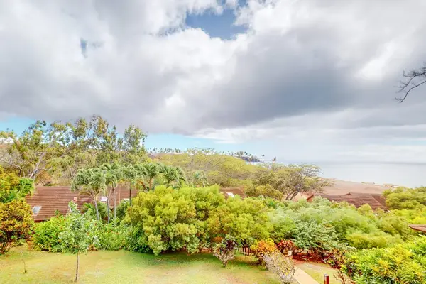 Relax in a serene island setting filled with lush greenery and coastal charm throughout