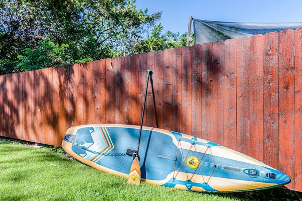 Complimentary Stand-Up Paddleboard & Paddle Included for Guest Use