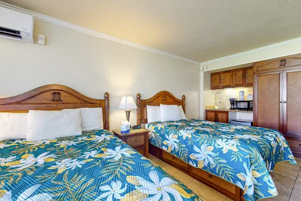 Cozy sleeping area with warm lighting and air conditioning.