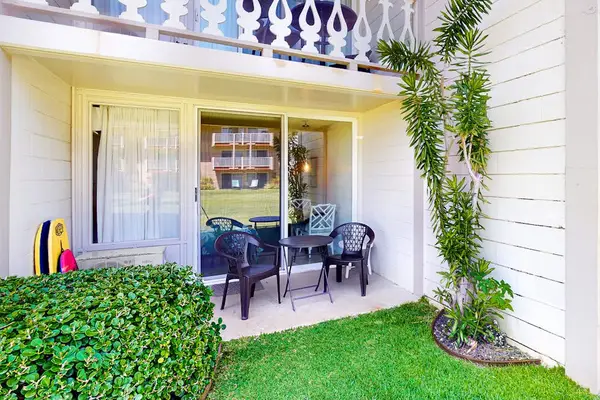 Private ground-floor lanai with outdoor seating.