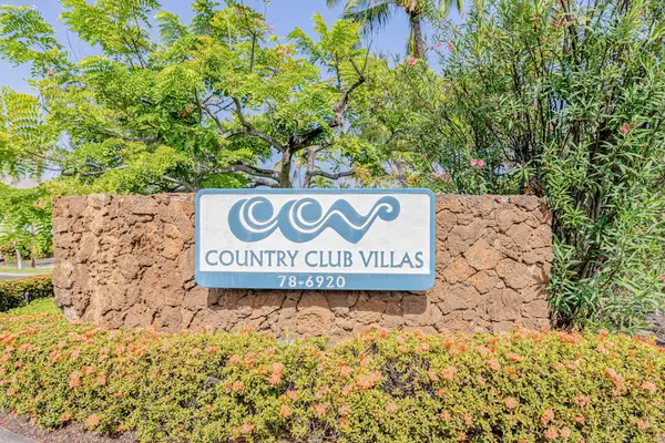 Easily locate the property by looking for the prominent Country Club Villas sign at the entrance