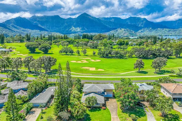 Striking residential golf course neighborhood with distant mountain ranges