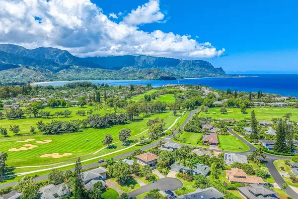Homes surrounded by lush green golf courses and views of the coastline.