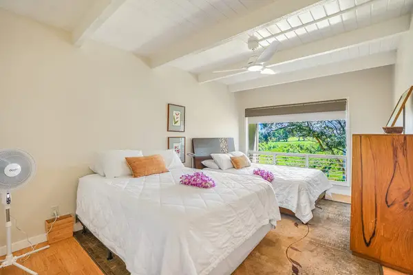 Bright guest bedroom with plenty of natural light.