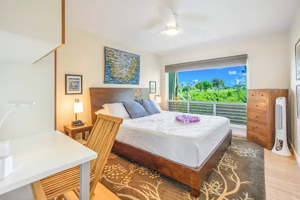 Peaceful primary bedroom with beautiful natural light.