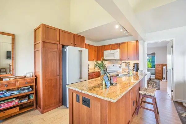 Large kitchen with plenty of counter space for cooking.