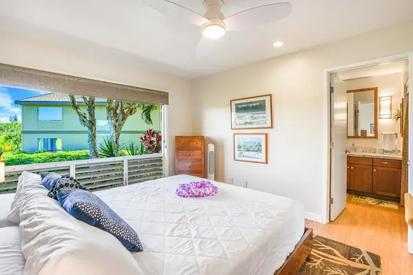 Spacious bathroom with a granite vanity and walk-in shower.