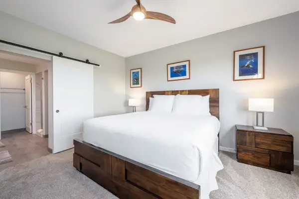 Comfortable bedroom with warm decor and plenty of natural light