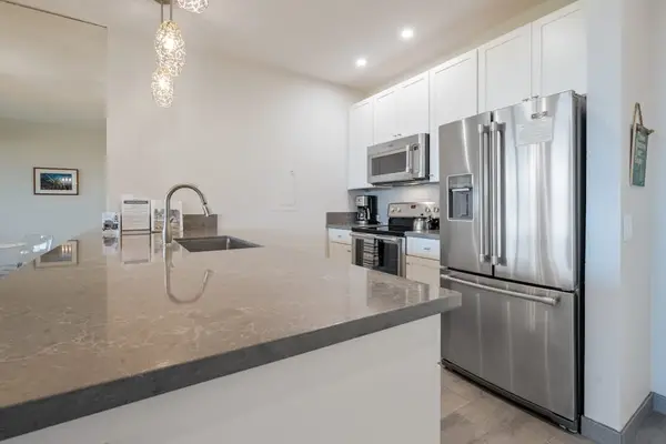 Bright kitchen with ample workspace and modern appliances