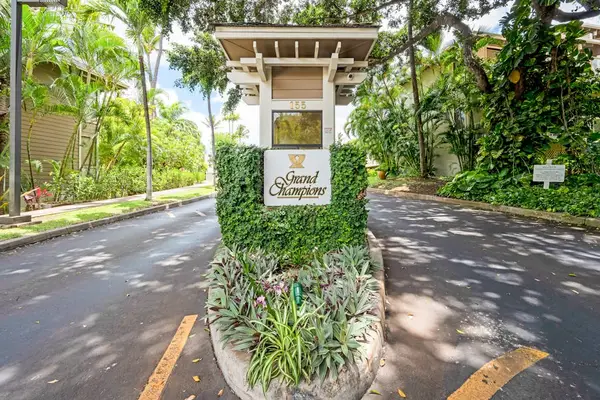 Welcoming property entrance surrounded by lush greenery