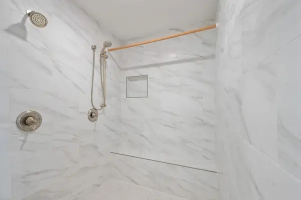 Beautifully tiled walk-in shower for a refreshing start to the day
