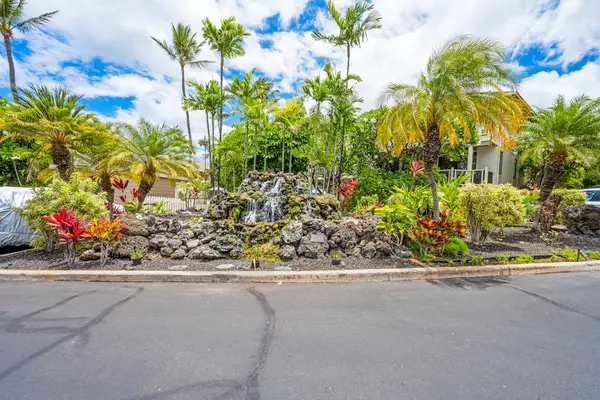 Beautifully landscaped resort grounds with colorful tropical plants