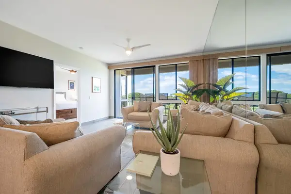 Open living area with plenty of natural light and comfortable seating