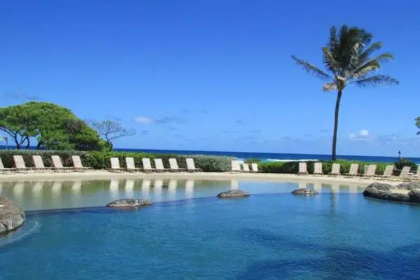 Spend sunny afternoons beside the sparkling pool