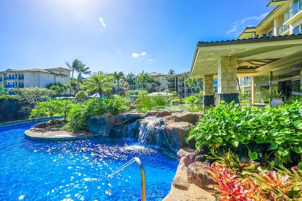 Tropical Pool Oasis Surrounded By Lush Greenery