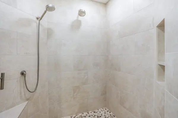Elegant walk-in shower with modern finishes