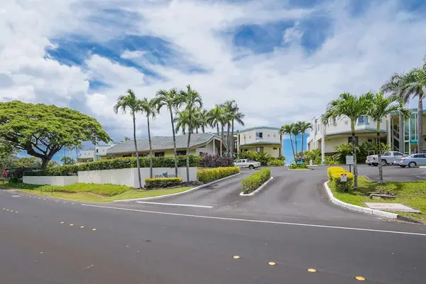 A welcoming entrance surrounded by lush tropical landscaping