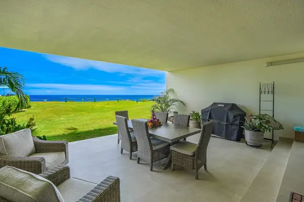 Covered outdoor dining area with breathtaking ocean views