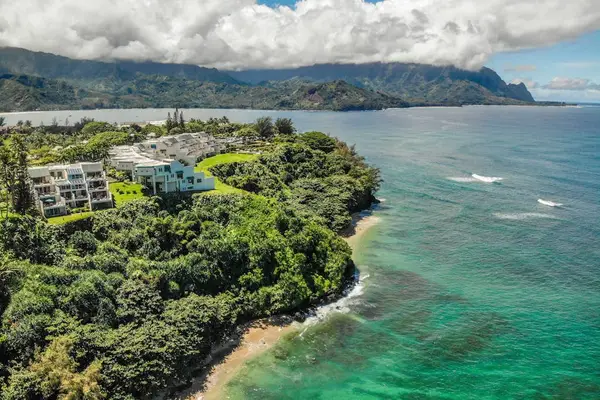 Aerial view of the oceanfront resort surrounded by tropical beauty