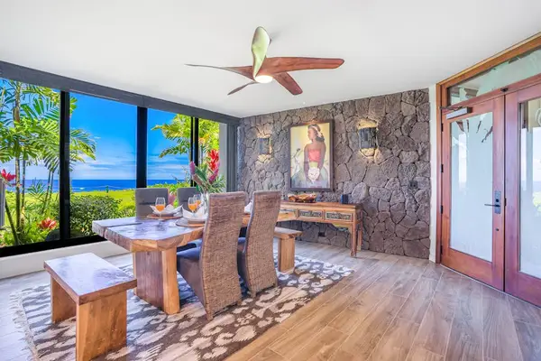 Gather around the dining table with tropical garden views