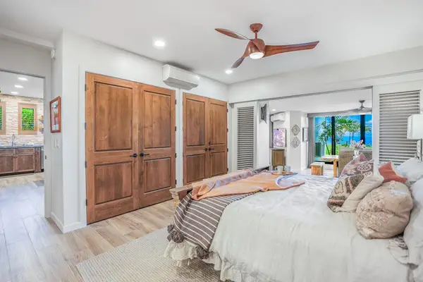 Cozy guest bedroom with ample storage and natural light