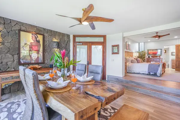 Gather around the dining table in a warm and inviting space