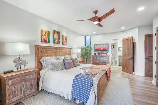 Unwind in the spacious primary bedroom after a day of adventure