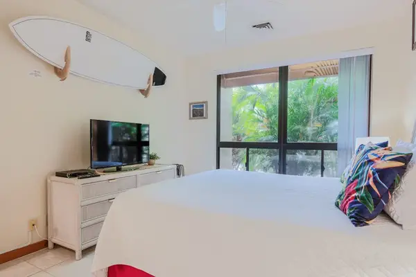 Cozy Bedroom Corner Featuring Island Surf Decor & Dedicated TV
