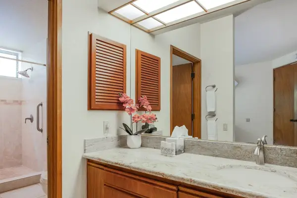 En-Suite Bathroom Vanity Area with Custom Wood Cabinetry