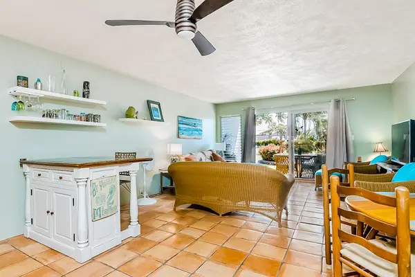 Kitchen island, dining table, and seating create a welcoming layout