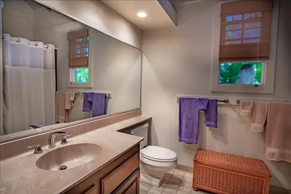 Refresh in the full bathroom featuring clean fixtures and convenient vanity space