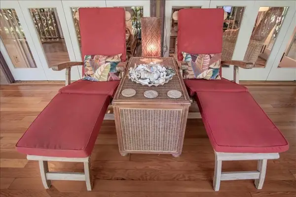 Spacious bench seating offers a relaxing spot to enjoy the tropical atmosphere