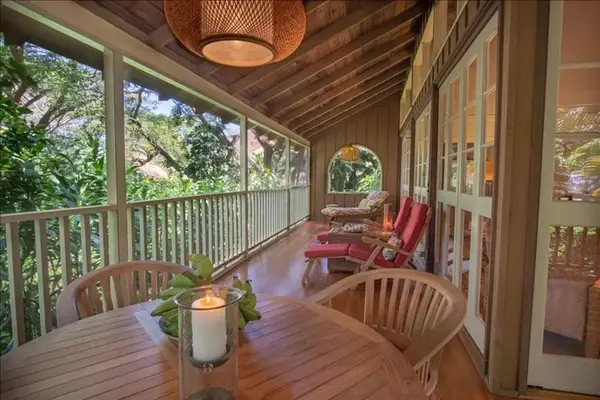 Unwind on the balcony with coffee, fresh air, and comfortable outdoor seating