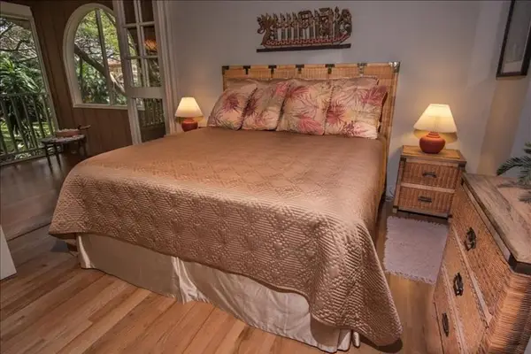 Lovely bedroom with easy balcony access for peaceful morning relaxation and sunshine
