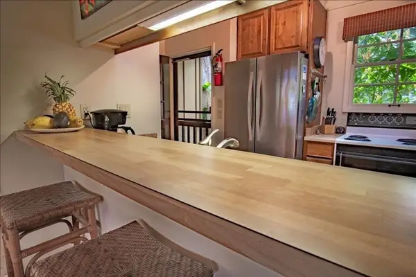 Bright kitchen with functional island creating extra space for meal preparation daily