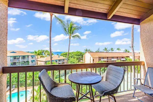 Private lanai with outdoor seating and pool views