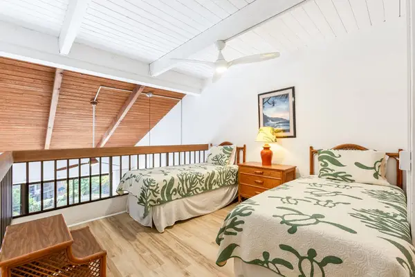 Loft bedroom with two beds