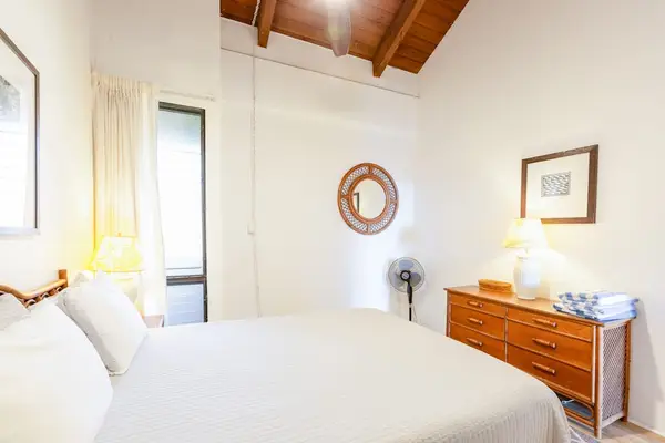 Cozy bedroom with dresser and natural light