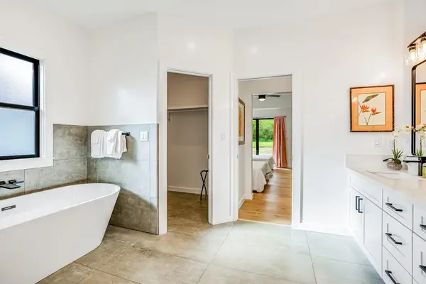 Clean, modern bathroom with open layout