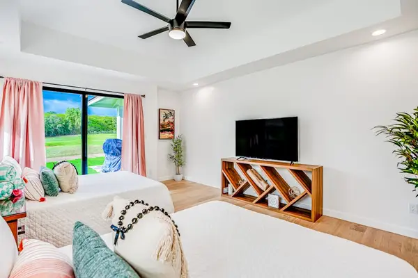 Bright bedroom with TV for relaxing evenings