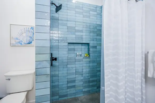 Walk-in shower with stylish tile accents
