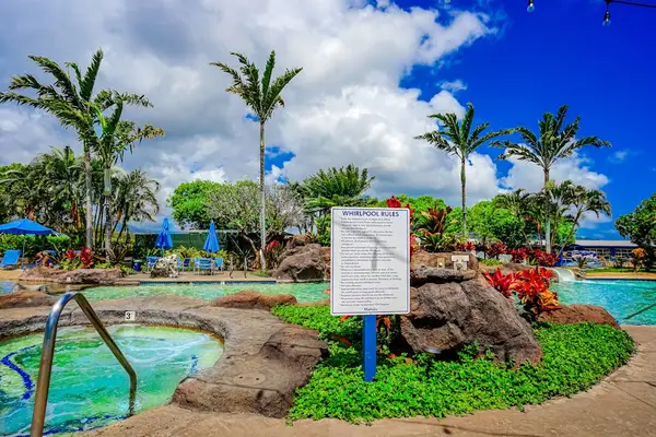 Relaxing pool area with lush landscaping