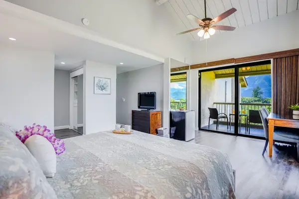 Bright bedroom offers plenty of space for relaxing vacation mornings