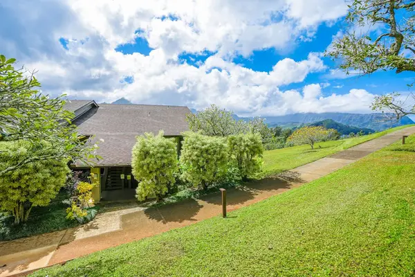 Peaceful property surroundings showcase vibrant greenery and distant mountain views