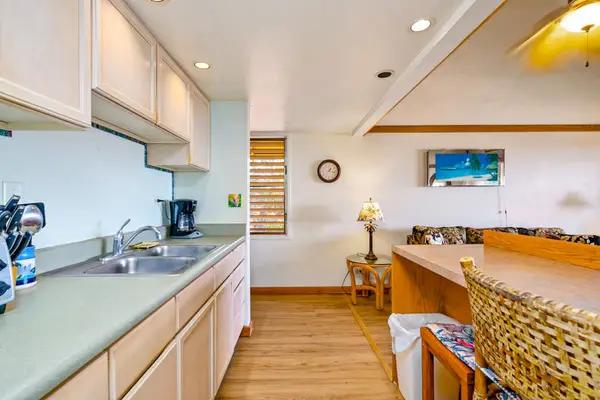 Inviting open layout combines cozy seating with convenient kitchen for memorable stays