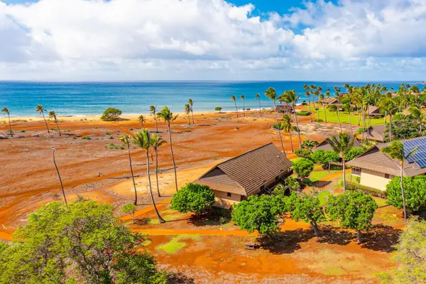 Tropical resort grounds offer easy access to the stunning nearby sandy shoreline