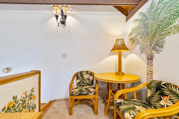 Loft dining corner highlights wood beams table seating and decor