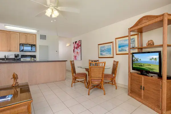 Sunny Dining Area With Open Kitchen