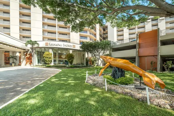 Elegant resort entrance featuring a striking lion statue.